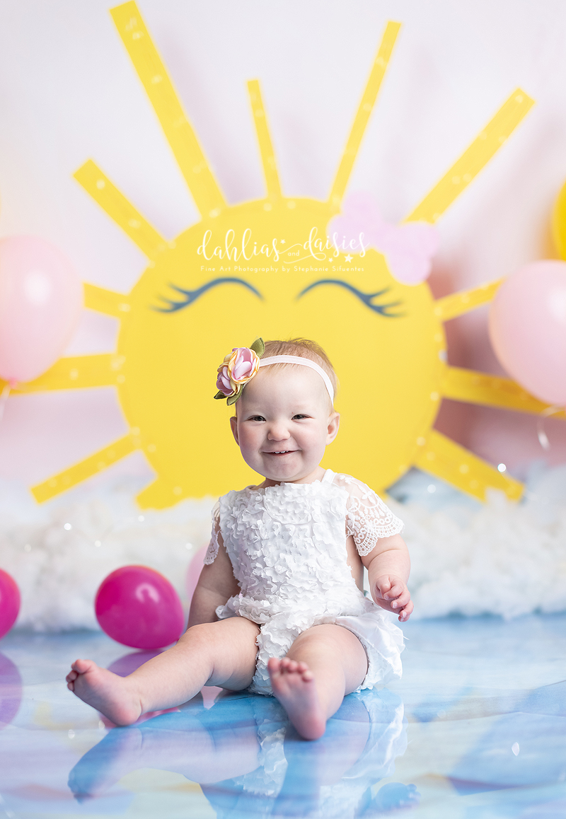 Smiling 1 year old at first birthday session