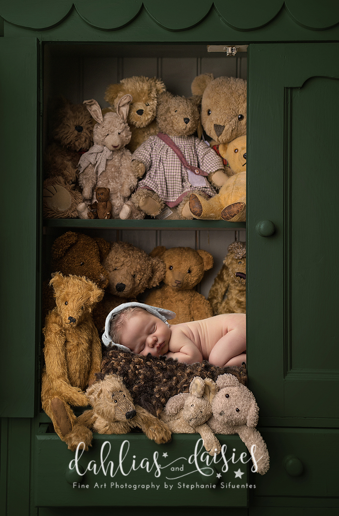 Newborn boy with teddy bears