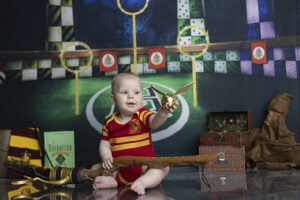 Baby boy at his Harry Potter themed cake smash