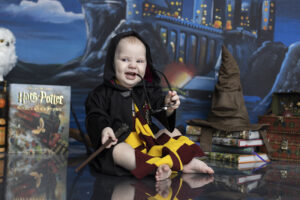 Boy boy laughs at his Harry Potter themed cake smash