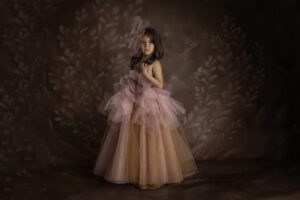Young girl in pink and orange gown