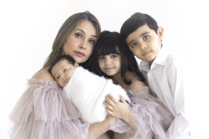 Mother and her children at newborn photoshoot