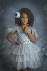 Beautiful 4 year old girl poses in blue dress at her Fine Art photography photo session