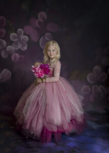 5 year old poses on pink and purple gown at her Fine Art Photography session