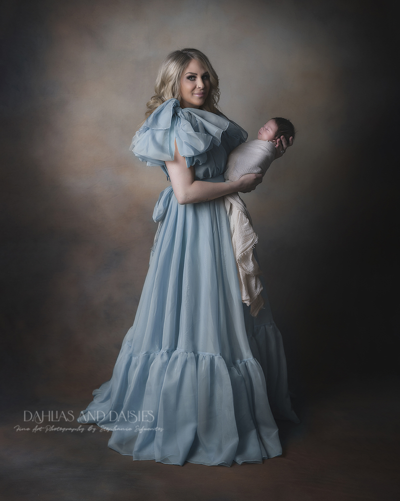 Mother holds newborn baby girl