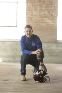 Senior football player in warehouse photography session