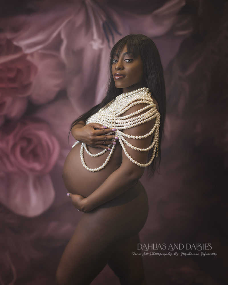 Pregnant woman poses at maternity photography session in Dallas