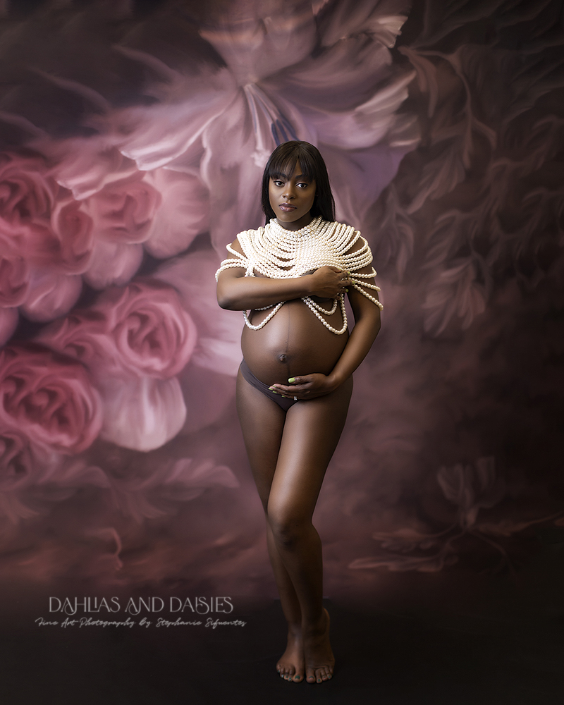 Pregnant woman poses at maternity photography session