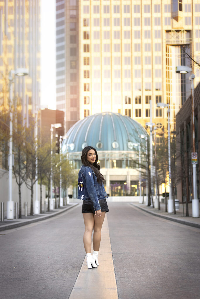 Senior girl walks through downtown Dallas