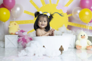 Baby splashes in tub