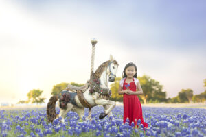 young girl in vibrant bluebonnet field