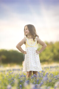 young girl in flower field