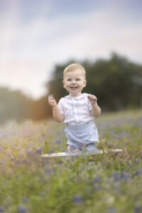 Boy smiles during bluebonnet photo session