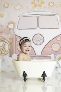 Baby laughs while splashing in a mini tub