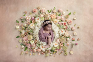 Newborn girl in. floral wreath