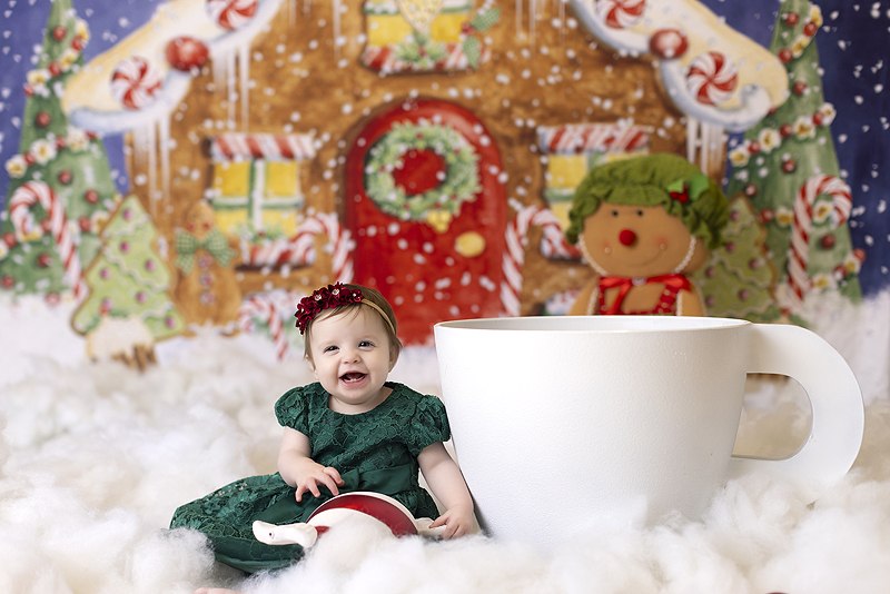 Baby smiles at first christmas photoshoot