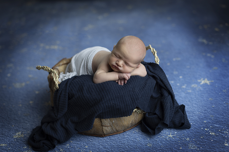 Newborn boy in basket