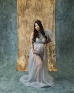 Pregnant woman wears blue tulle gown