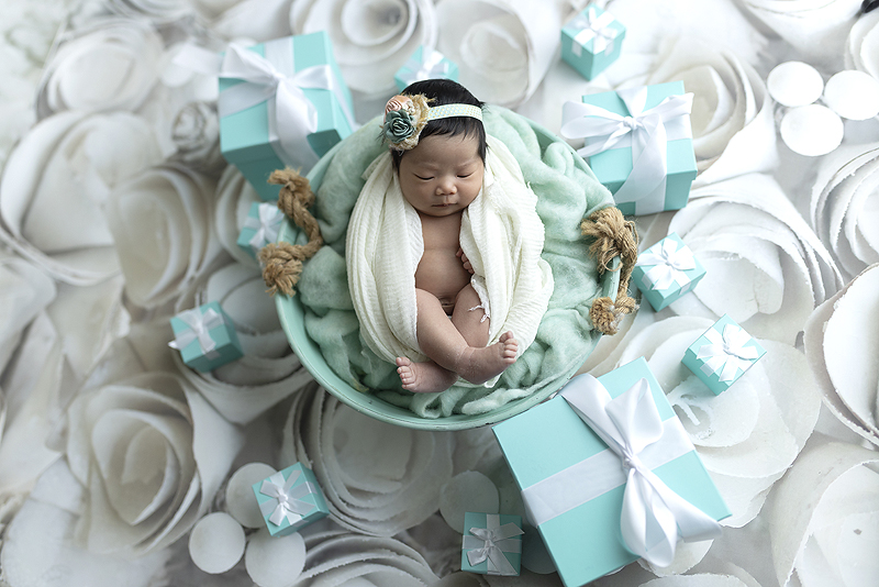 Newborn girl and Tiffanys boxes