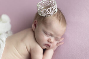 Newborn girl wears crown