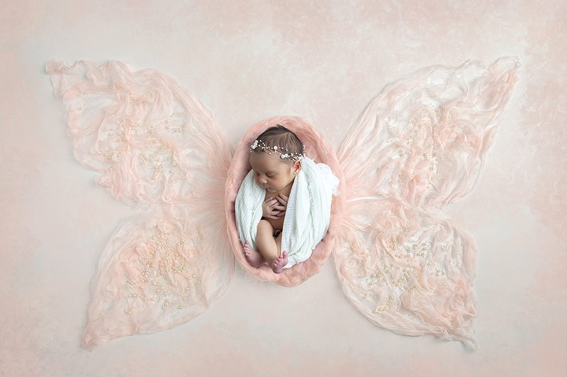 Newborn girl as butterfly